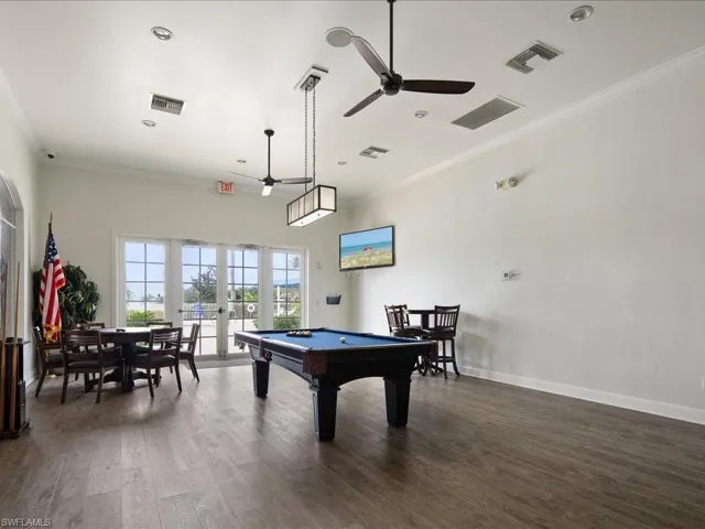 Playroom with french doors, crown molding, billiards, and dark hardwood / wood-style floors