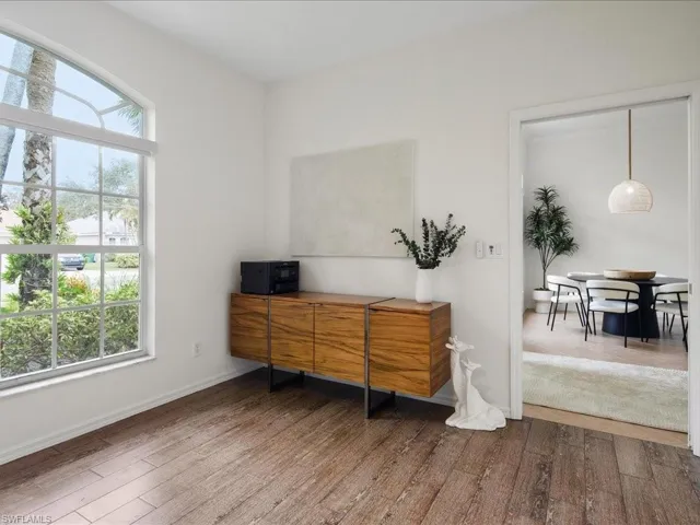 Office space featuring a healthy amount of sunlight and wood-type flooring