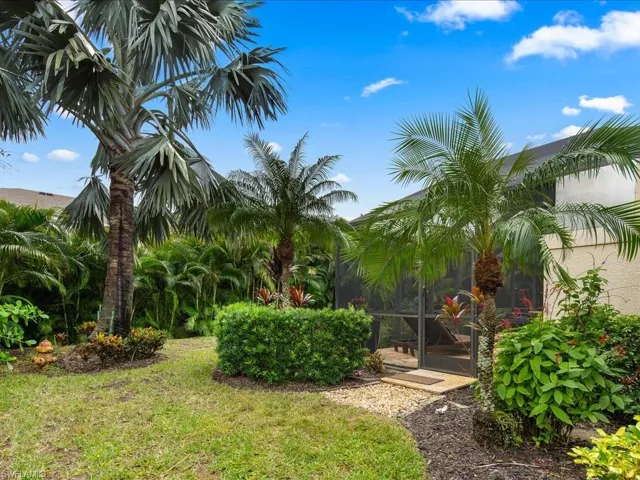 View of yard with a sunroom