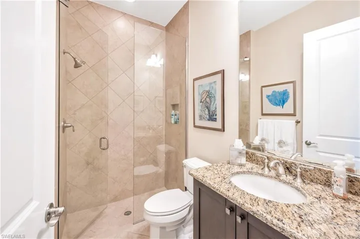 Floor to ceiling tile shower.
