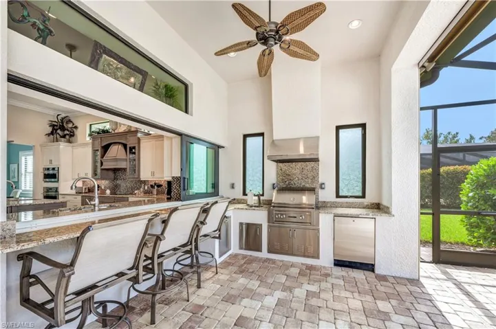 Now this is Florida living.  Gas grill & fridge