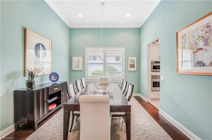 Rich wood flooring & 12 ft. ceilings in dining room