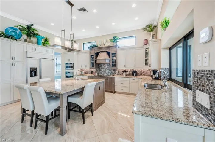 Oversize Monogram fridge & wall ovens.