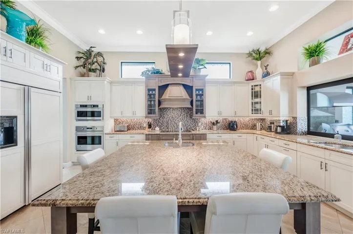 Large Center island with sink, disposal & bar seating.