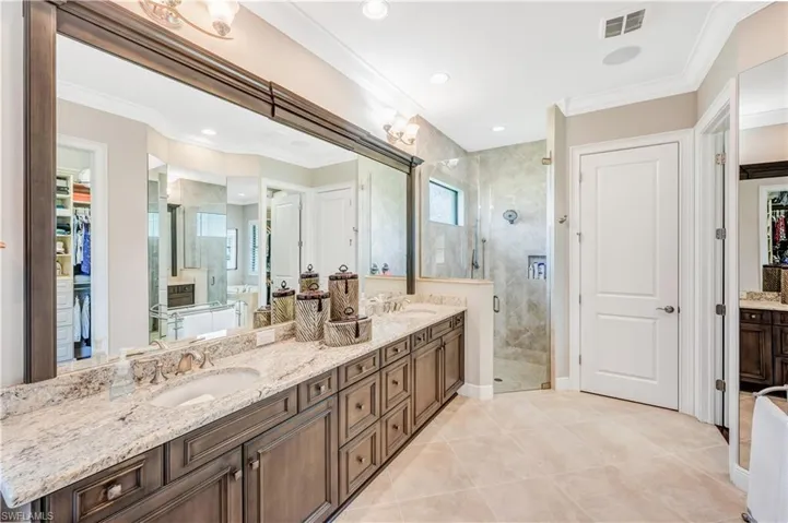 Dual sinks & plenty of rich cabinetry