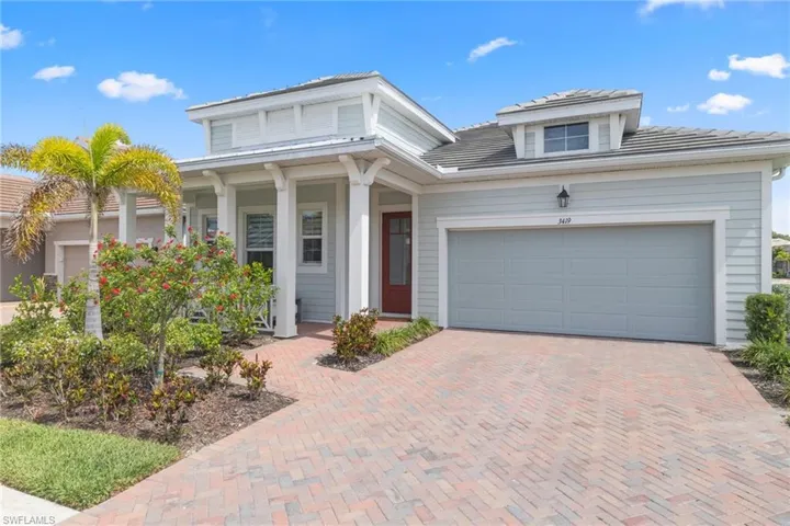 A Brick papered driveway and impeccable curb appeal set the tone for what the inside reveals...