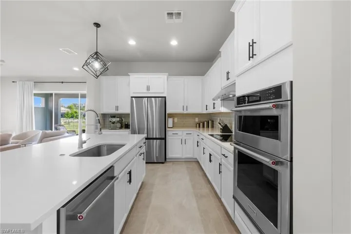 Upgraded kitchen package, featuring Stainless Steel KitchenAid Appliances, quartz countertops and white shaker cabinets