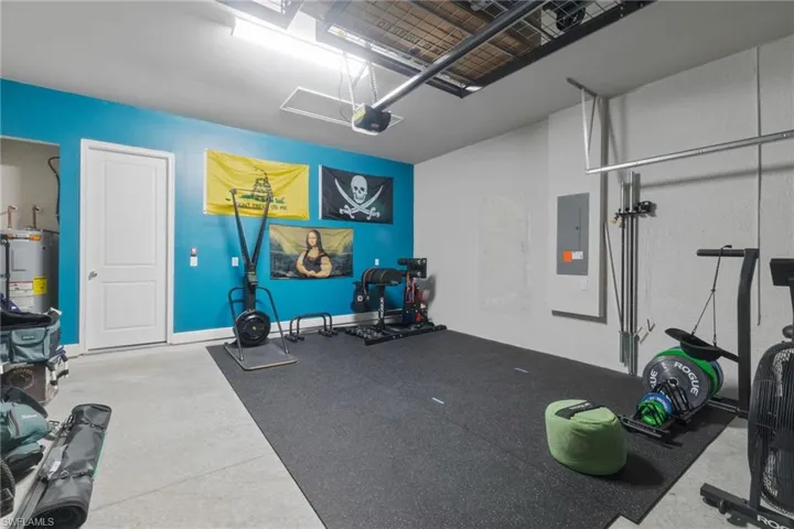 Spacious two-car garage, currently used as a home gym