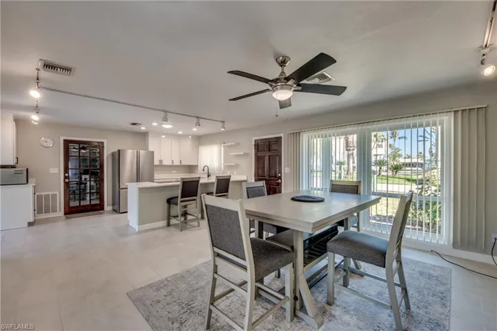 Dining room featuring ceiling fan and sink
