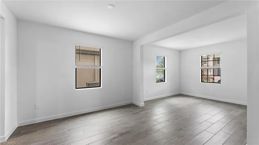 Empty room featuring hardwood / wood-style flooring