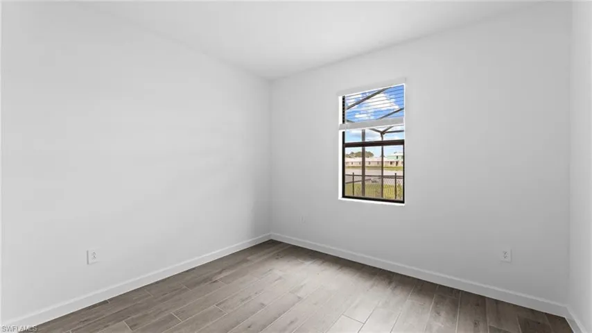 Unfurnished room with wood-type flooring