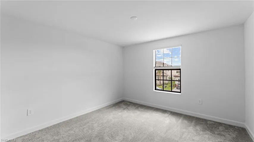 Empty room with carpet floors