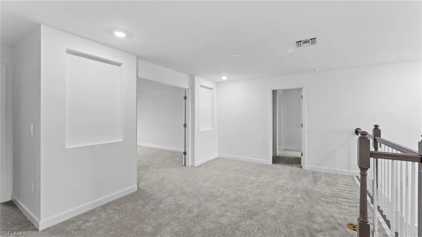 View of carpeted spare room