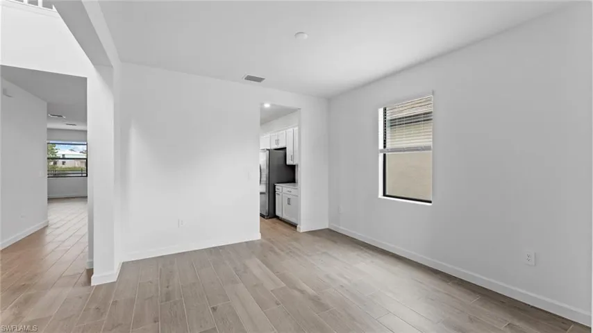 Unfurnished room with light hardwood / wood-style floors