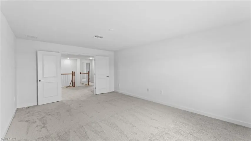 Unfurnished bedroom featuring carpet