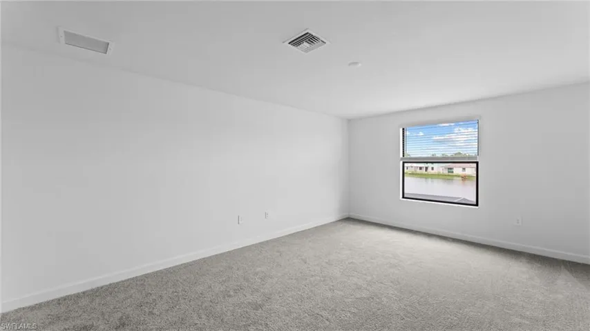 Spare room featuring carpet