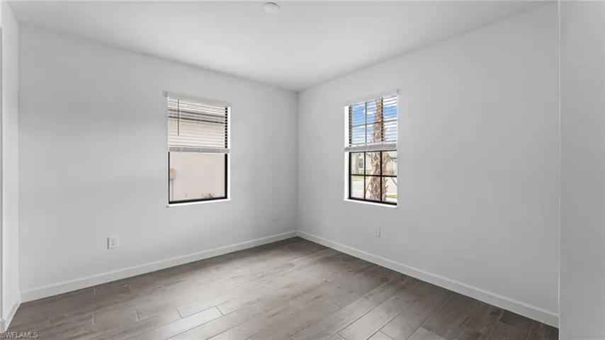 Empty room featuring hardwood / wood-style flooring