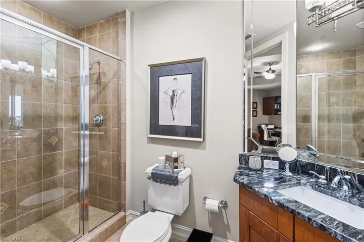 2nd ensuite bath has a single vanity, walk in shower.