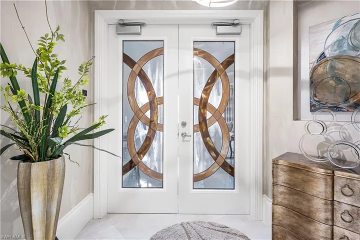 Breathtaking double custom doors as you step off the elevator into your private foyer.