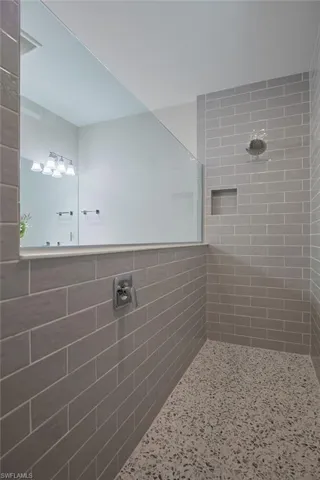 Bathroom with a tile shower