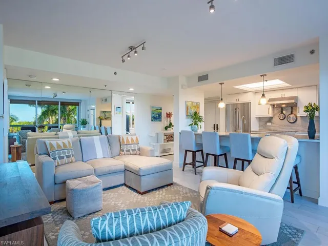 Living area featuring light wood-style flooring, rail lighting, and recessed lighting