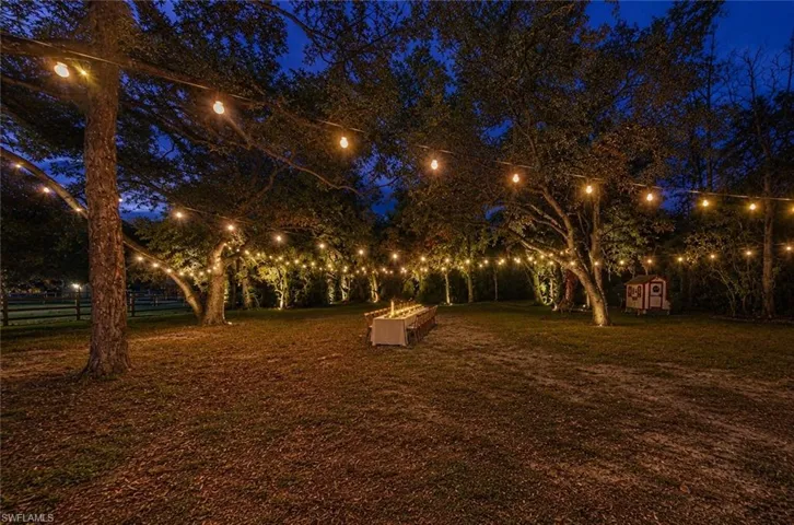 Virtually staged. Added bistro lighting and out door table.