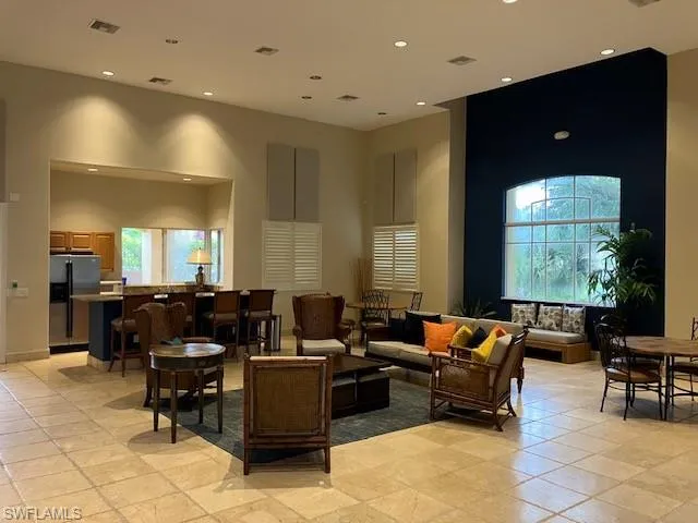 Community lobby with a high ceiling and recessed lighting