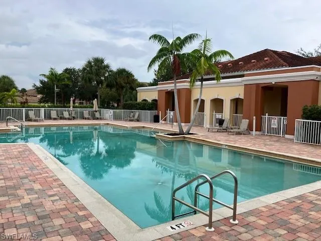 Community pool featuring a patio area