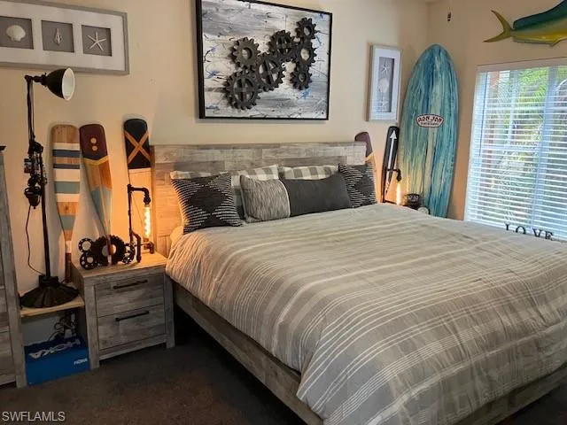 Bedroom with dark carpet