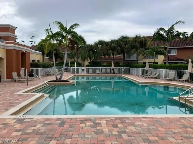 Community pool with a patio