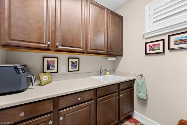 Built-in cabinetry with a warm wood finish, featuring both upper and lower storage