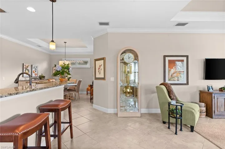 Breakfast bar seating opens to the gourmet kitchen