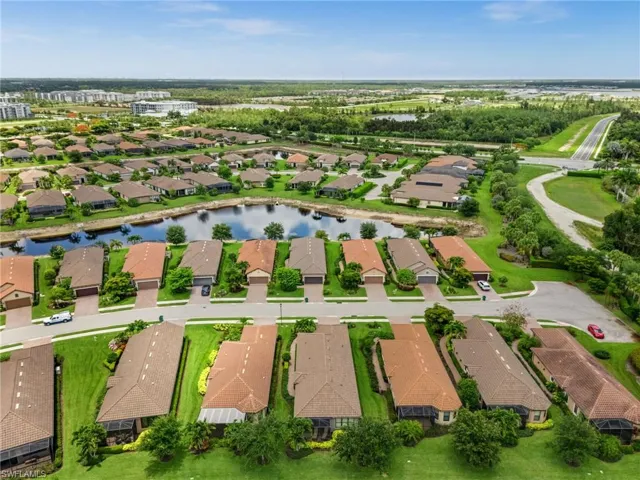 Aerial perspective showcasing a residential community with numerous single-story homes