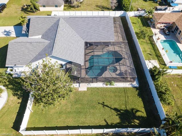 Aerial view of the fenced yard looking west to east.
