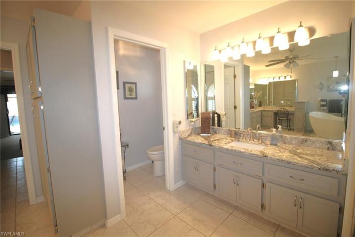 Master Bathroom's second Vanity and Water Closet with pocetjing door.