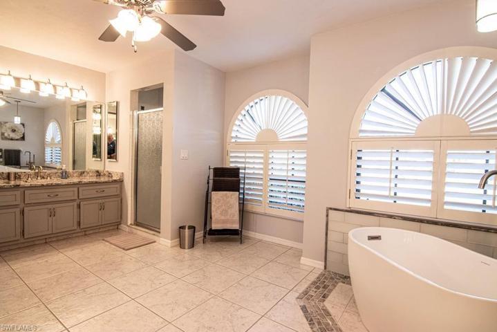 Walk-in shower to the left of the windows.