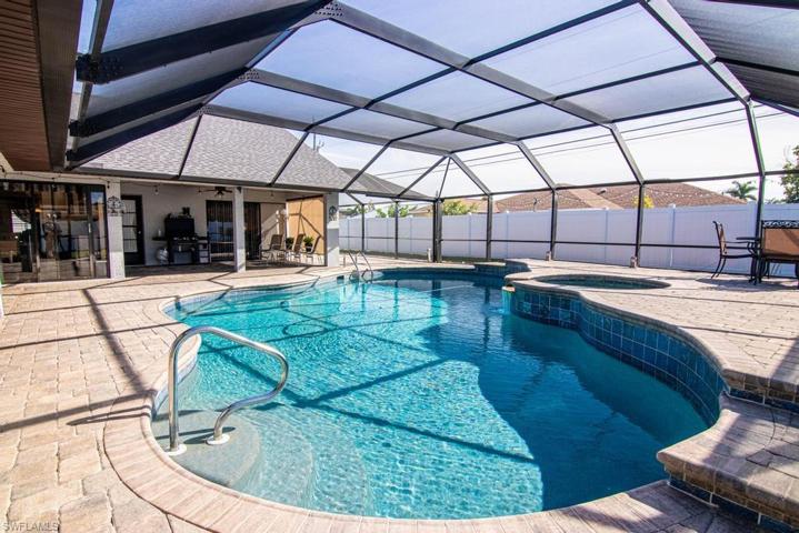 Large free form propane heated Pool and Spa. Pool's deep end is 7-1/2 feet deep.