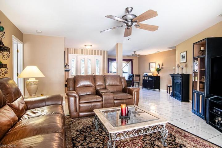 The Living Room with a formal Dining Area in the background.