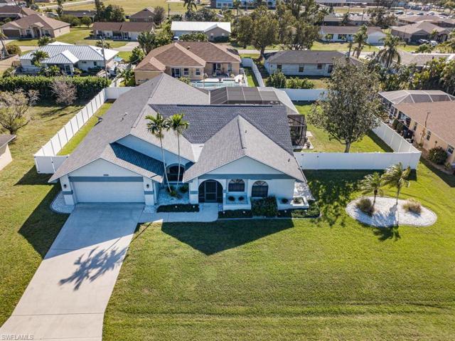 Aerial view of this 3 Lot Site 3 Bedroom, 2-1/2 Bathroom Pool Home.