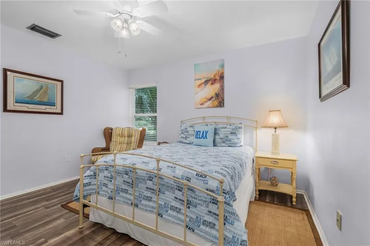 Bedroom featuring wood finished floors and ceiling fan