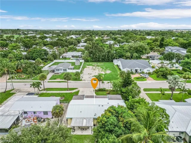 Aerial perspective of suburban area featuring a tree filled landscape