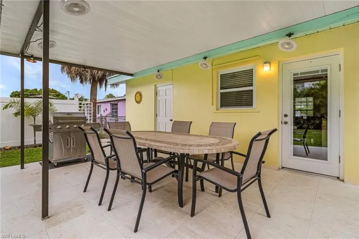View of patio with outdoor dining area
