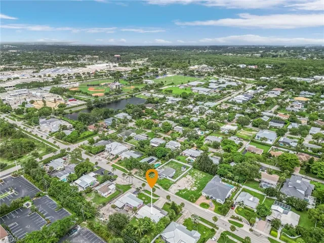 Aerial overview of property's location with a large body of water and nearby suburban area