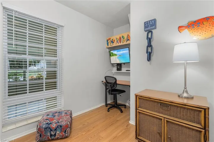 Office area with light wood finished floors and baseboards