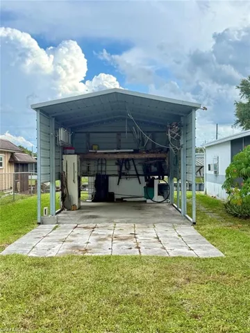 View of car parking with a carport and driveway