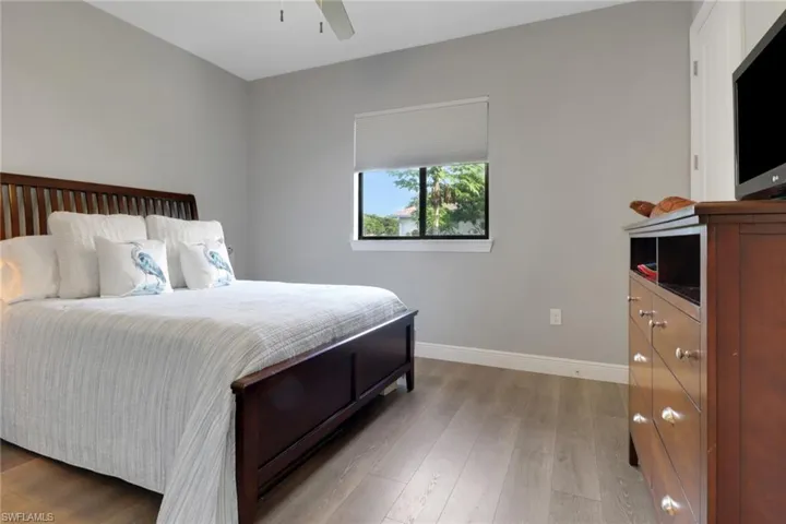 Bedroom featuring light wood-style flooring and a ceiling fan