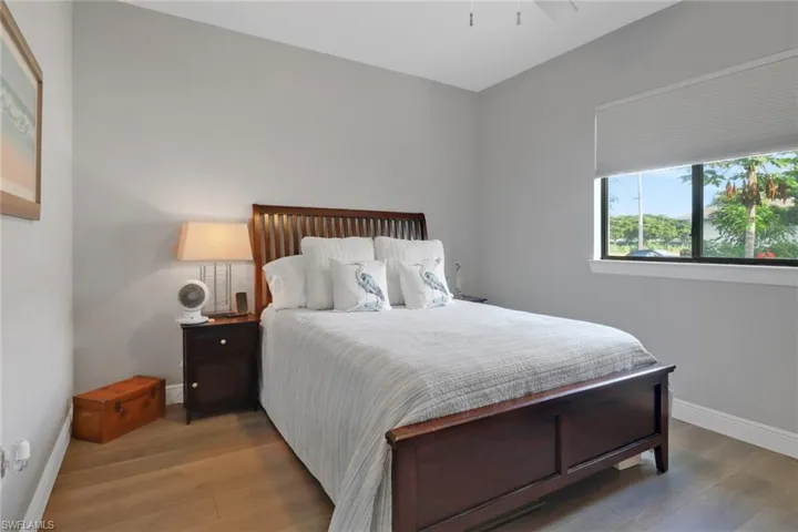 Bedroom featuring wood finished floors and a ceiling fan