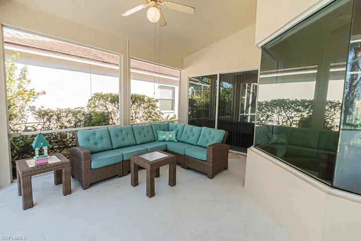 Sunroom with vaulted ceiling and ceiling fan