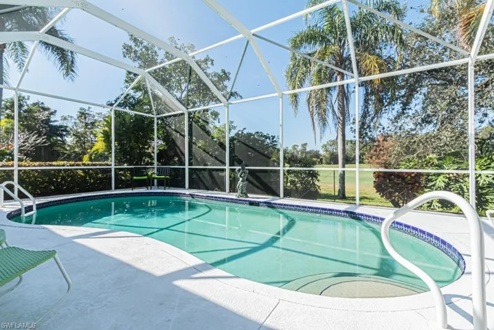 View of swimming pool with a patio and a lanai