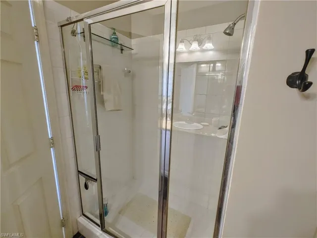 Bathroom with a shower with shower door